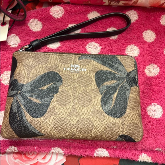 Coach Handbags - Coach Tan and Black Monogram Wristlet